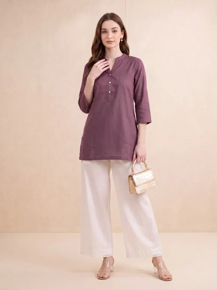 Same photoshoot color swapped to a mauve colorway, identical model and pose